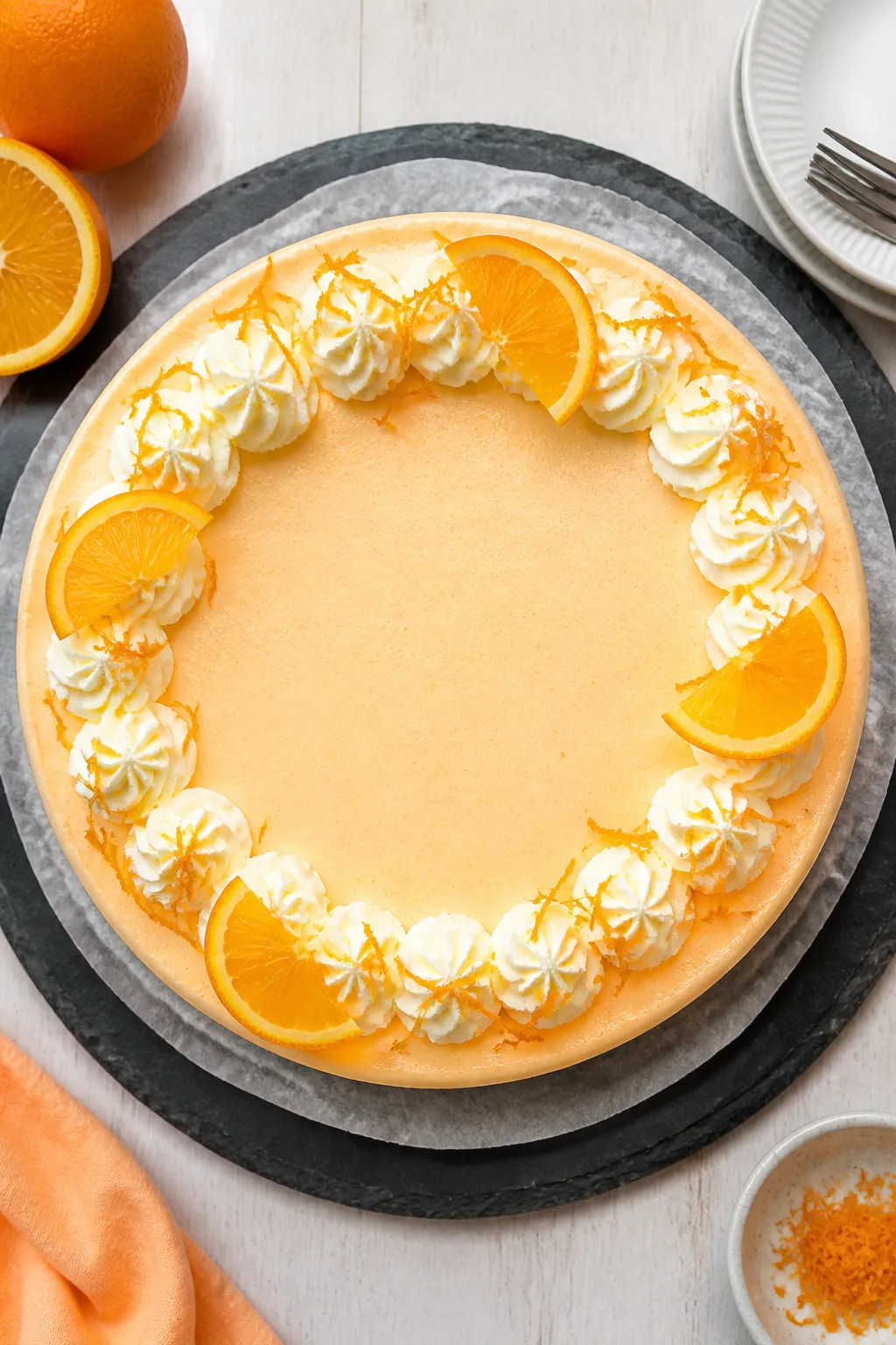 Final presentation, top view: Tasty of the fully set cheesecake on a parchment-lined springform base