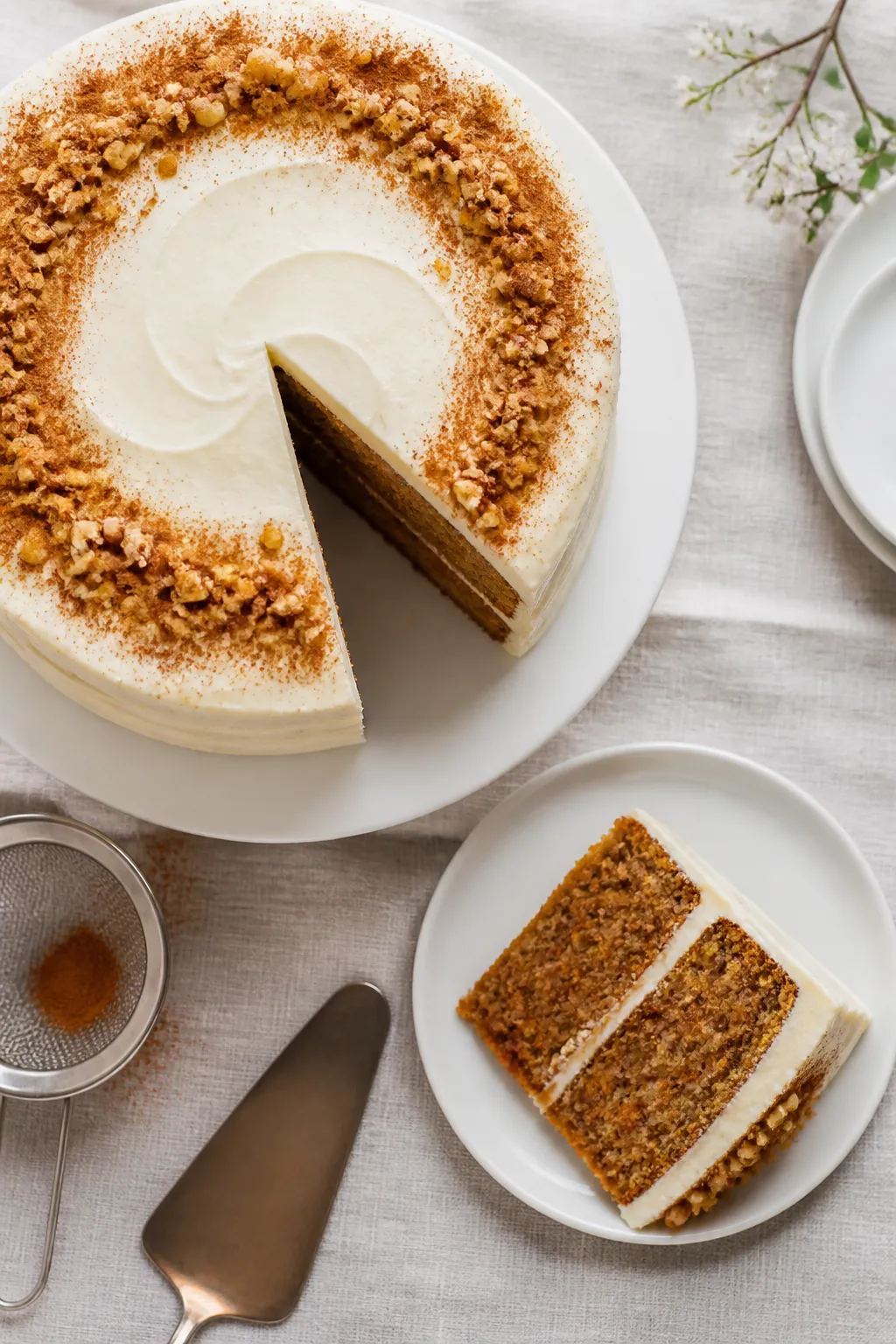 Final dish/top view: Overhead shot of a two-layer gluten-free, dairy-free carrot cake generously fro